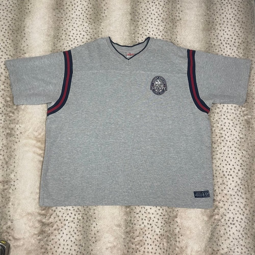 Disney’s Snow White, Grumpy hasn’t smiled, the Disney store T-shirt